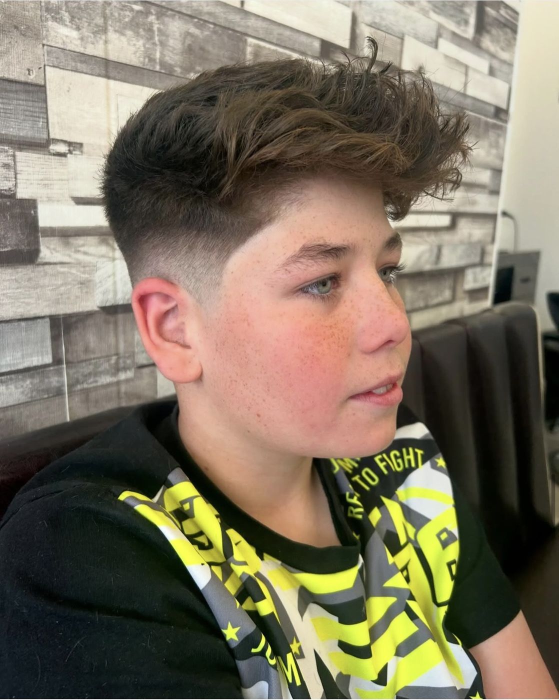Boy's textured quiff with tapered fade