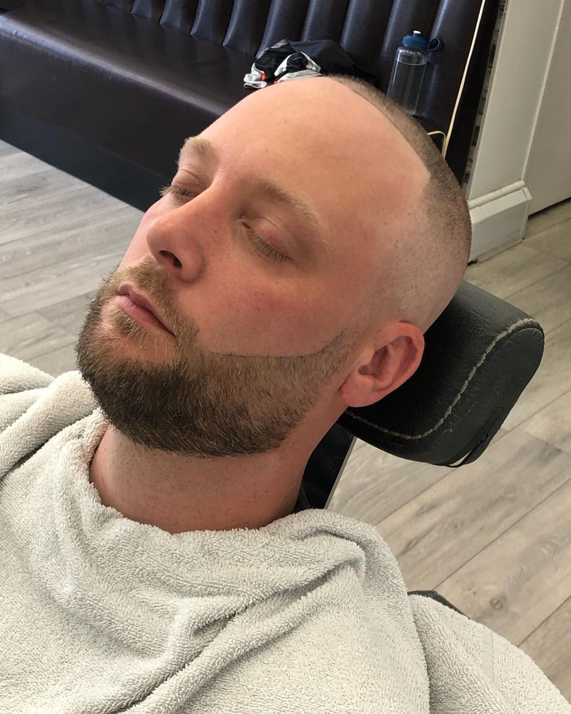 Customer relaxing before a hot towel shave